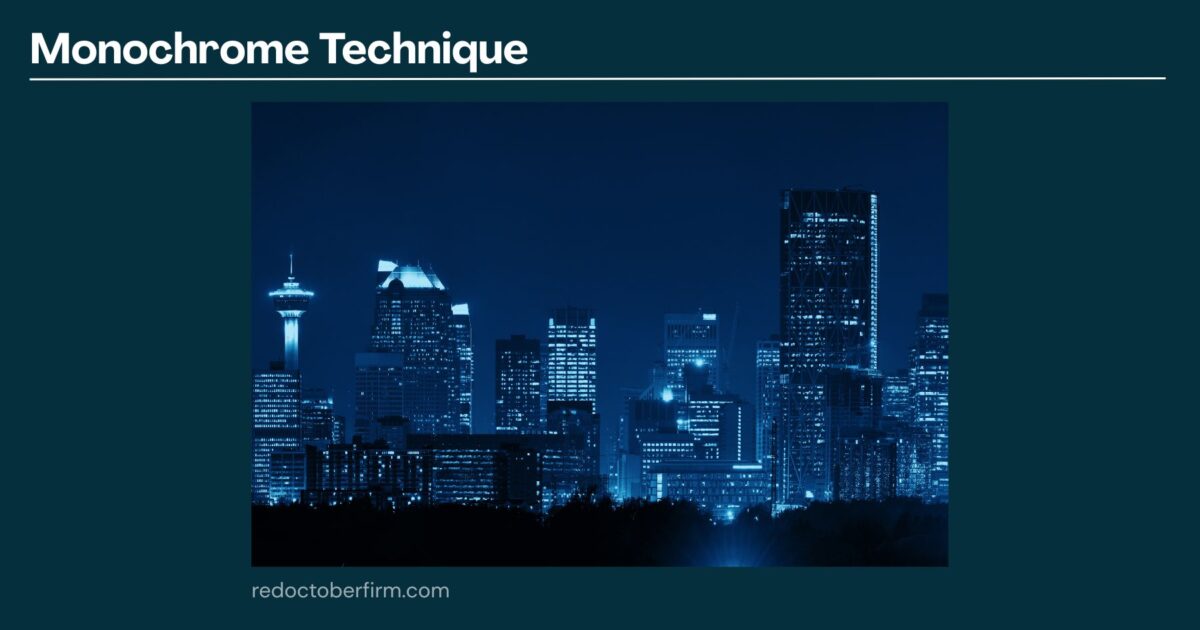 A City Skyline At Night Shown In Blue Monochrome, With Various Illuminated Buildings And A Dark Sky Above. The Text &Quot;Monochrome Technique&Quot; Appears At The Top.