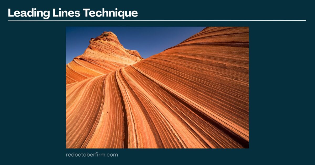 Photo Of Layered Sandstone Rock Formations With Prominent Curved Lines Leading Toward A Rock Peak, Illustrating The Leading Lines Technique In Photography.