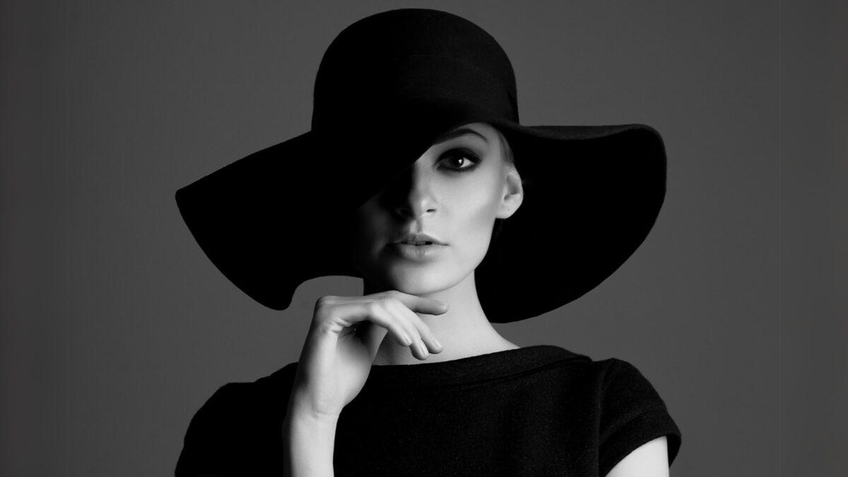 A Black And White Portrait Photo Of A Woman In A Hat, Showcasing Photography Tips For Capturing Striking Portraits.