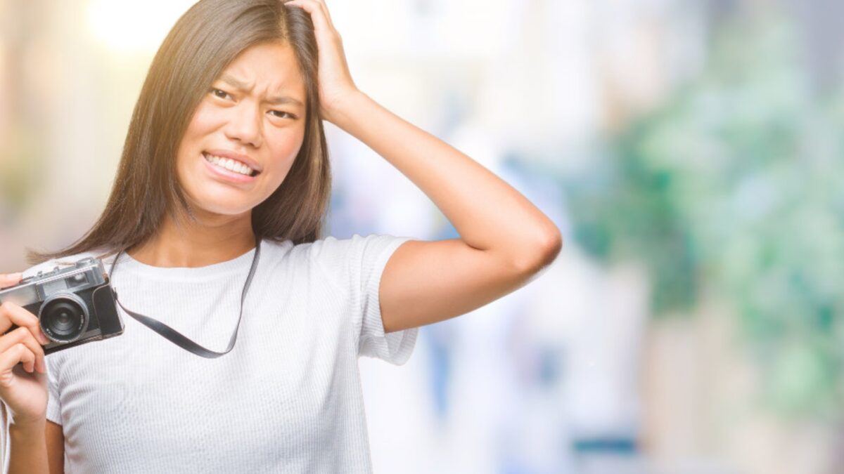 An Asian Woman Passionately Captures Moments With Her Camera, Overcoming Mistakes As A Photographer.