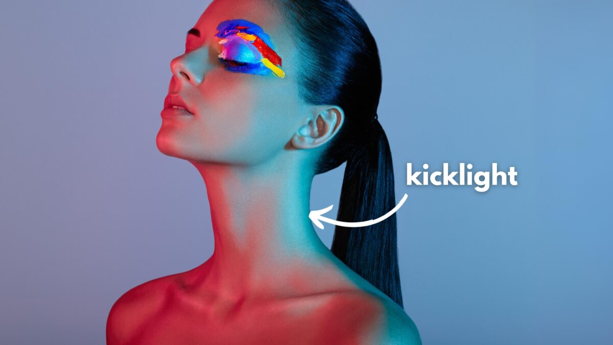 An Image Of A Woman With Vibrant Makeup, Captured Using A Photography Lighting Setup.