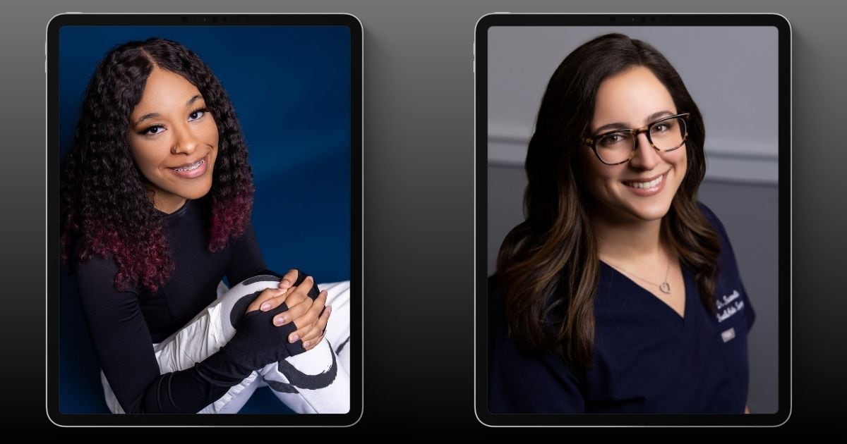 Two Women Smiling In Front Of Two Ipads, Striking Poses For Pictures.