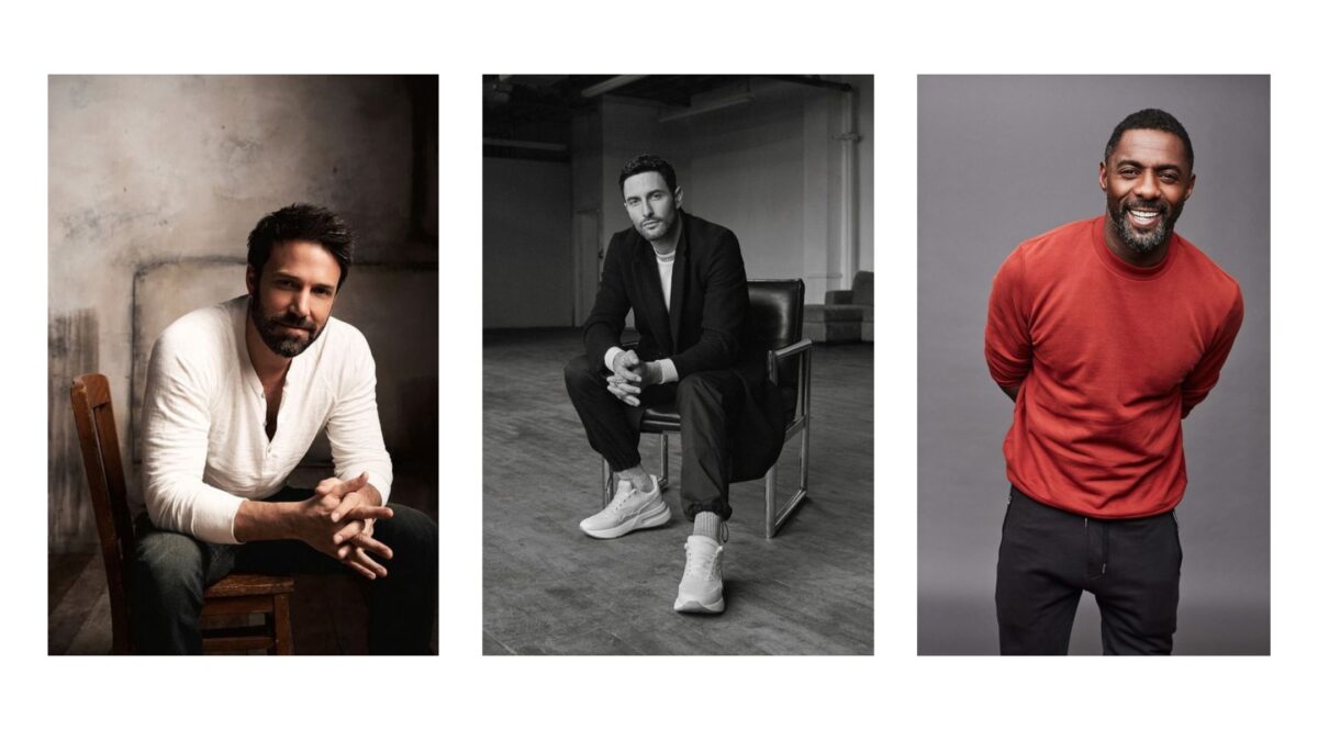 A Black And White Photo Of A Man Sitting On A Chair, Striking Male Model Poses.