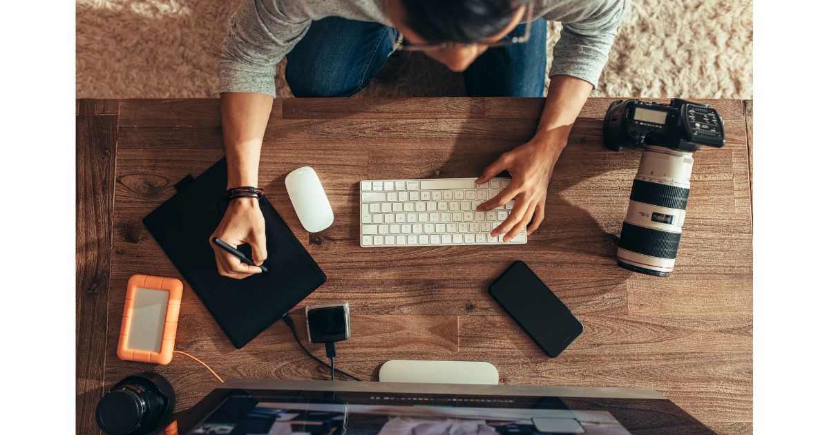 A Woman, Laptop, Camera.