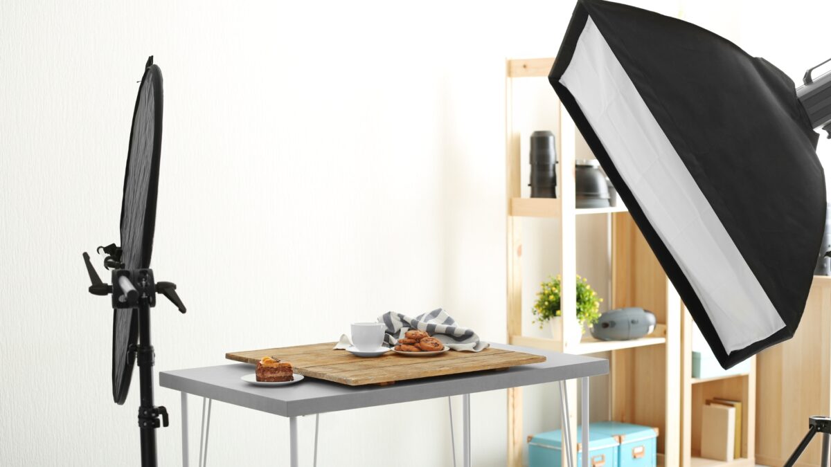 A Professional Photo Studio Equipped With A Black Light And A Table, Perfect For Capturing Stunning Photographs Using The Specially Designed Photography Lighting Kit.