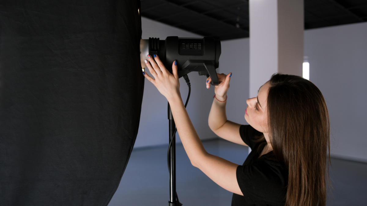 Photographer Adjusting Light