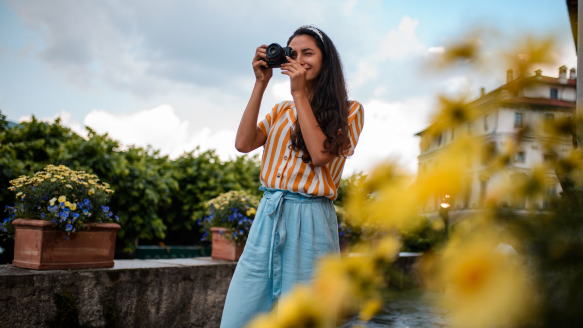 Photographer Taking Pictures Of Flowers